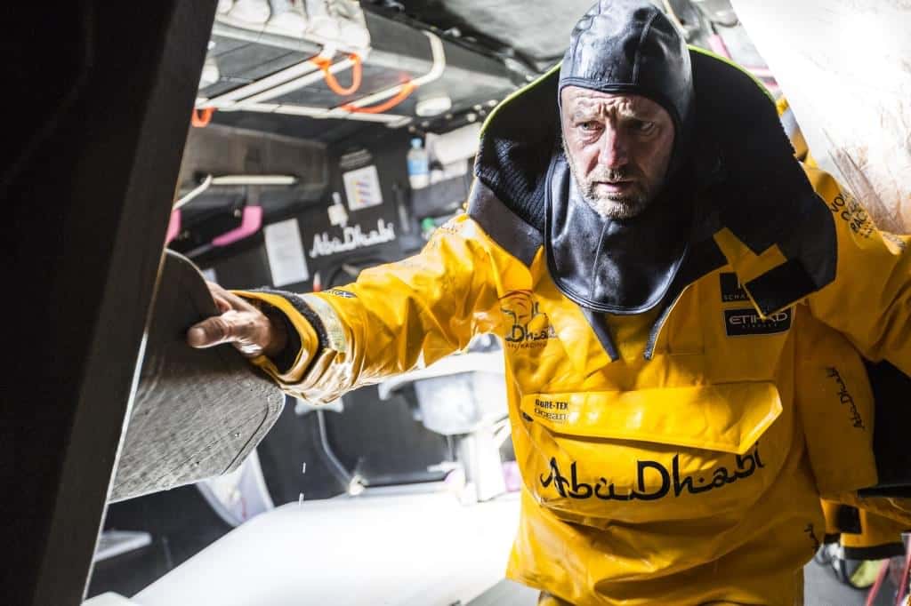 March 27, 2015. Leg 5 to Itajai onboard Abu Dhabi Ocean Racing. Day 9. A drenched Ian Walker drops below deck to confer with Simon 'SiFi' Fisher when the next gybe will be.